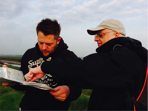 Solopress staff study the OS Map and pinpoint desired routes