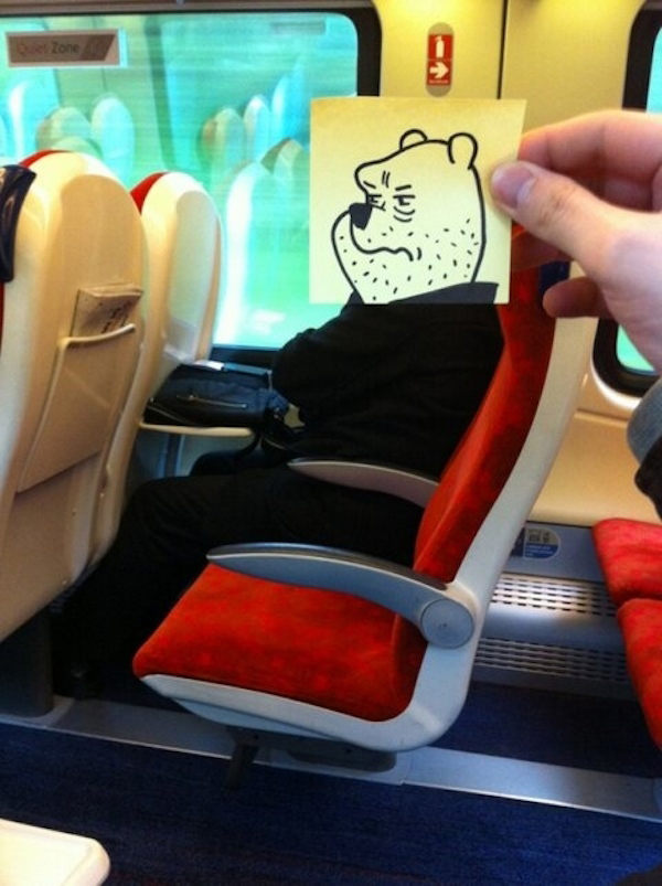 Funny sketch of a grizzly bear's face with arms folded on the train to work