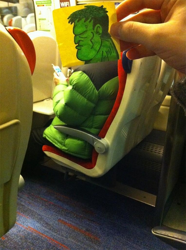 Funny image of a guy wearing a green puffer jacket on his iPhone and October Jones has put a Hulk head on top.