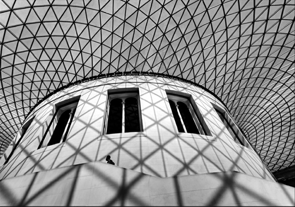 Black and white landscape photo looking up onto a spiral ceiling