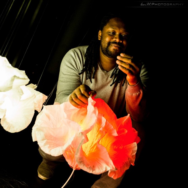 Photo of Junior Fritz Jacquet and his paper art