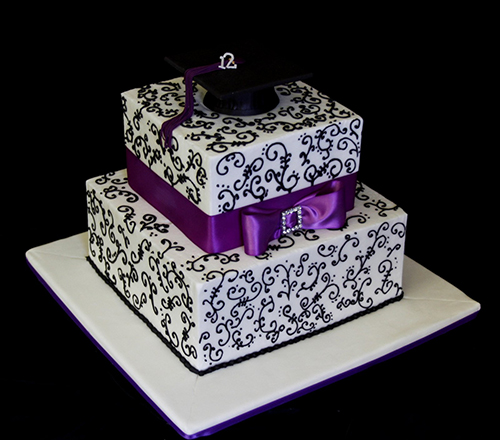 graduation cake with a purple bow