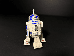 Figura de R2-D2 con accesorio de sable láser